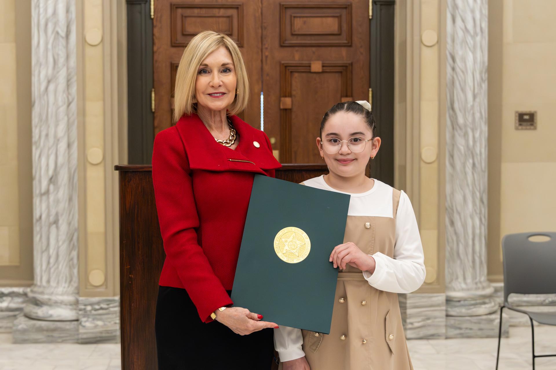 Sophia Chavarria Rivera holding certificate