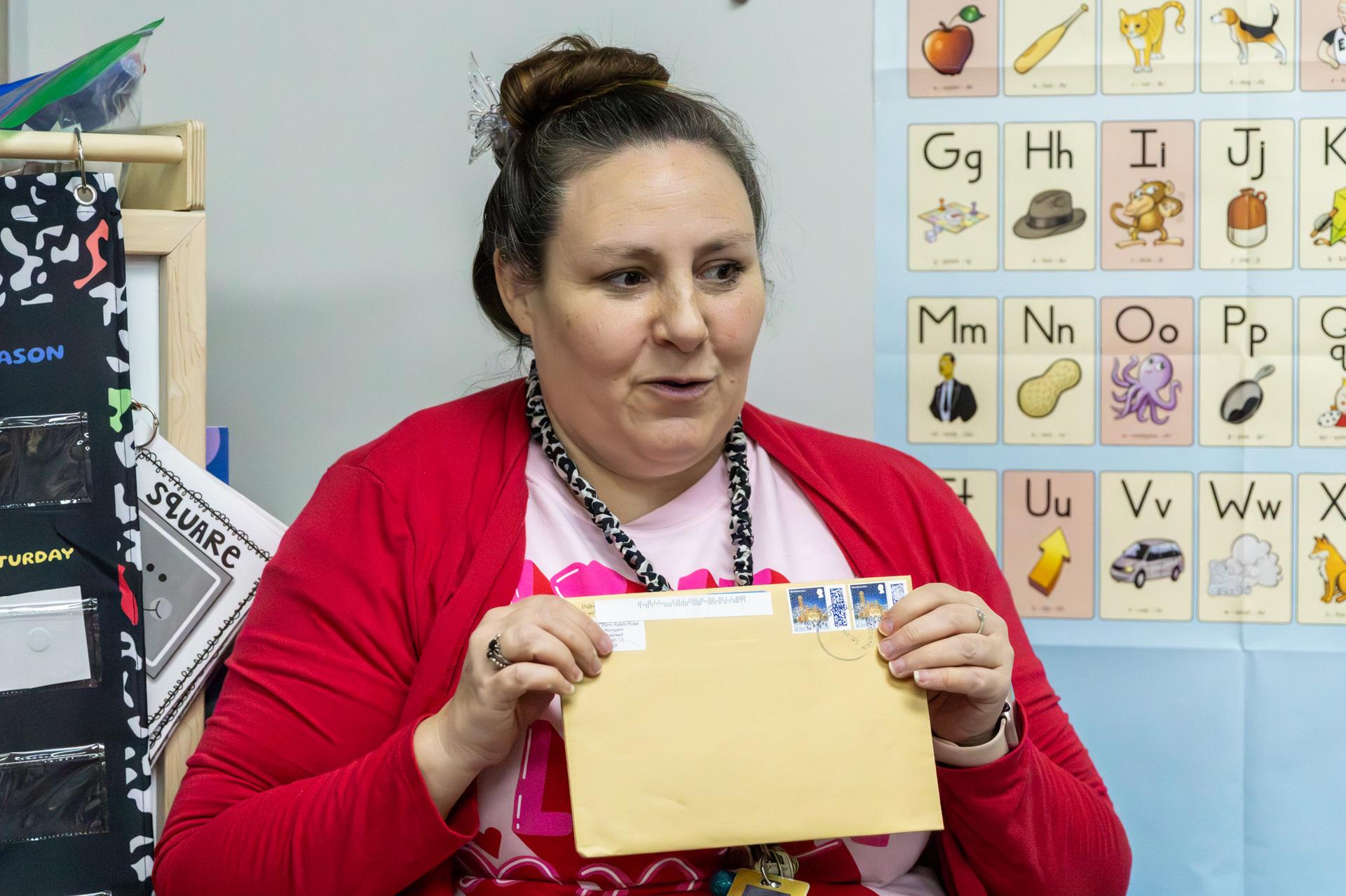 teacher showing off mail