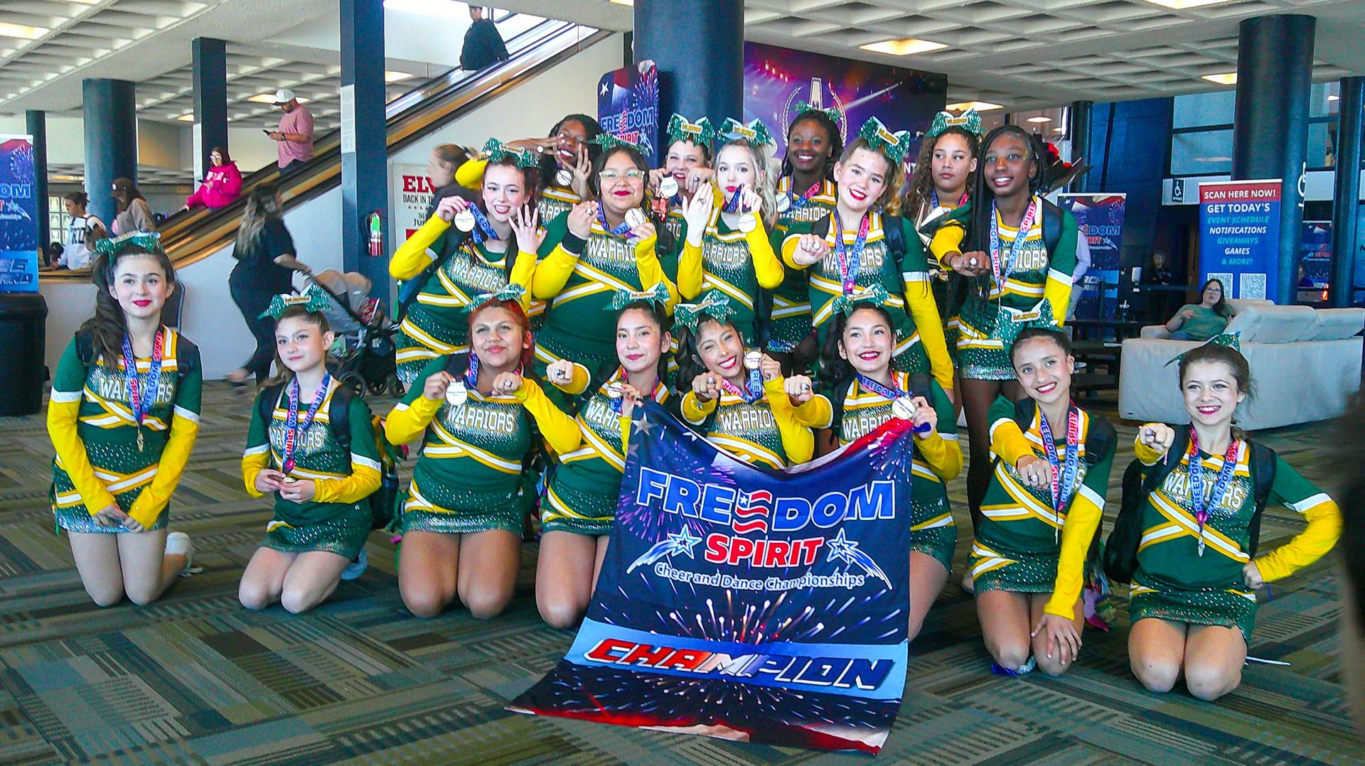 group photo of cheer holding the 