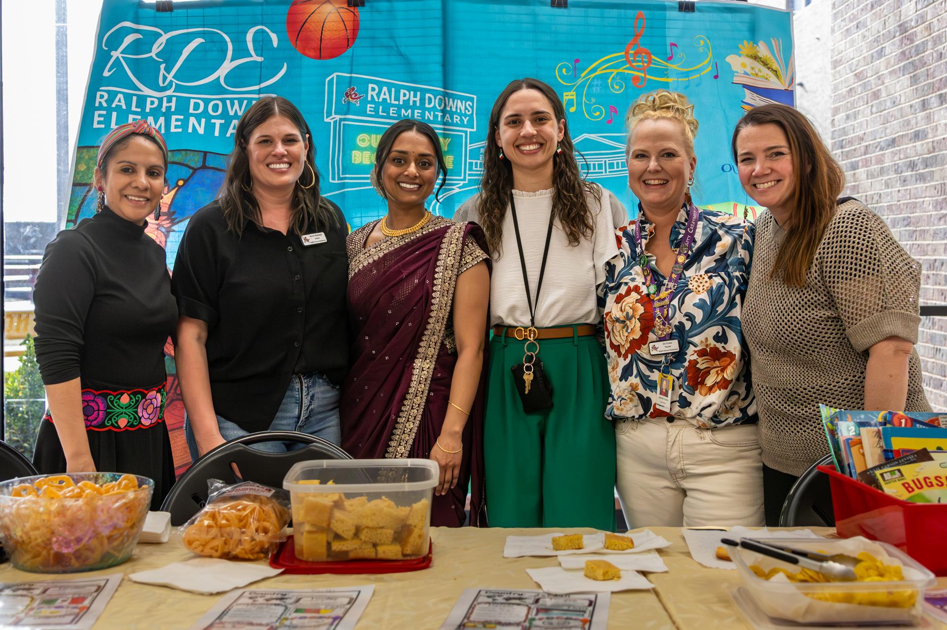 teachers and staff taking a group photo