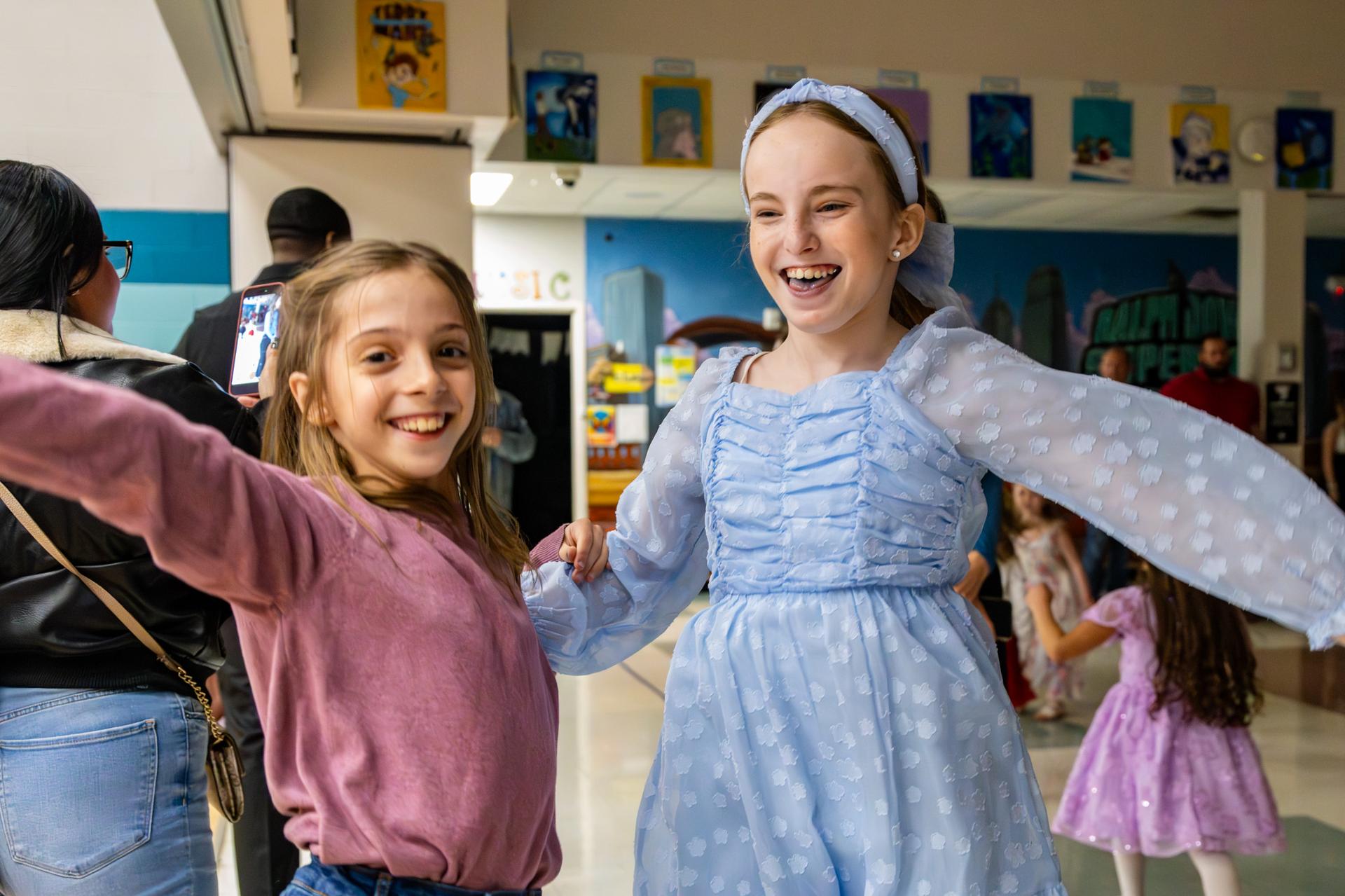 2 students smiling in excitement at ball
