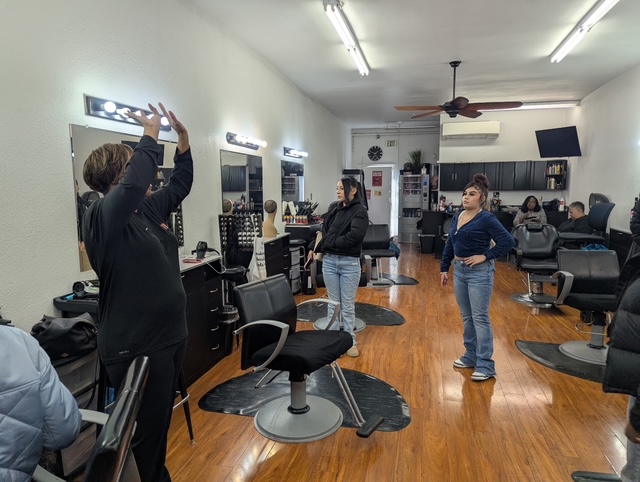 Student's at an event through Xplore at Hairworks Salon.