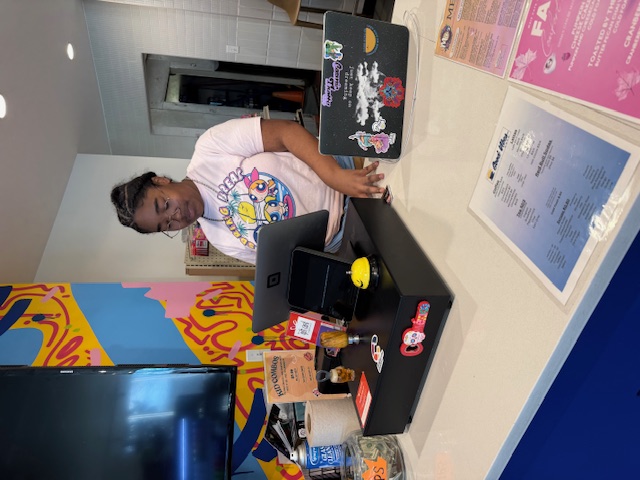 Student working at a job shadow at Maiz Restaurant