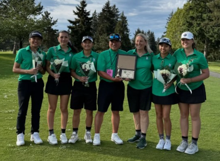 Kentwood High School girls golf team and coaches proudly displaying their West Central District 4A Championship win.