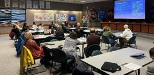 Staff and community members participating in the January Teacher Certification Information Session.
