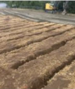 Beginning of field drainage project. Slit drains in field.