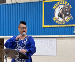 Darice Johnson, Executive Director, School and Leadership Success speaking at Meridian Middle School's MLK Assembly