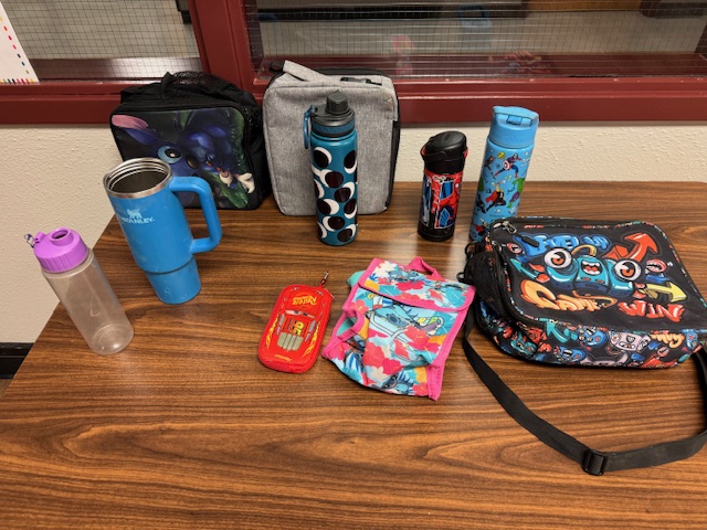 water bottles and lunch boxes in lost & found