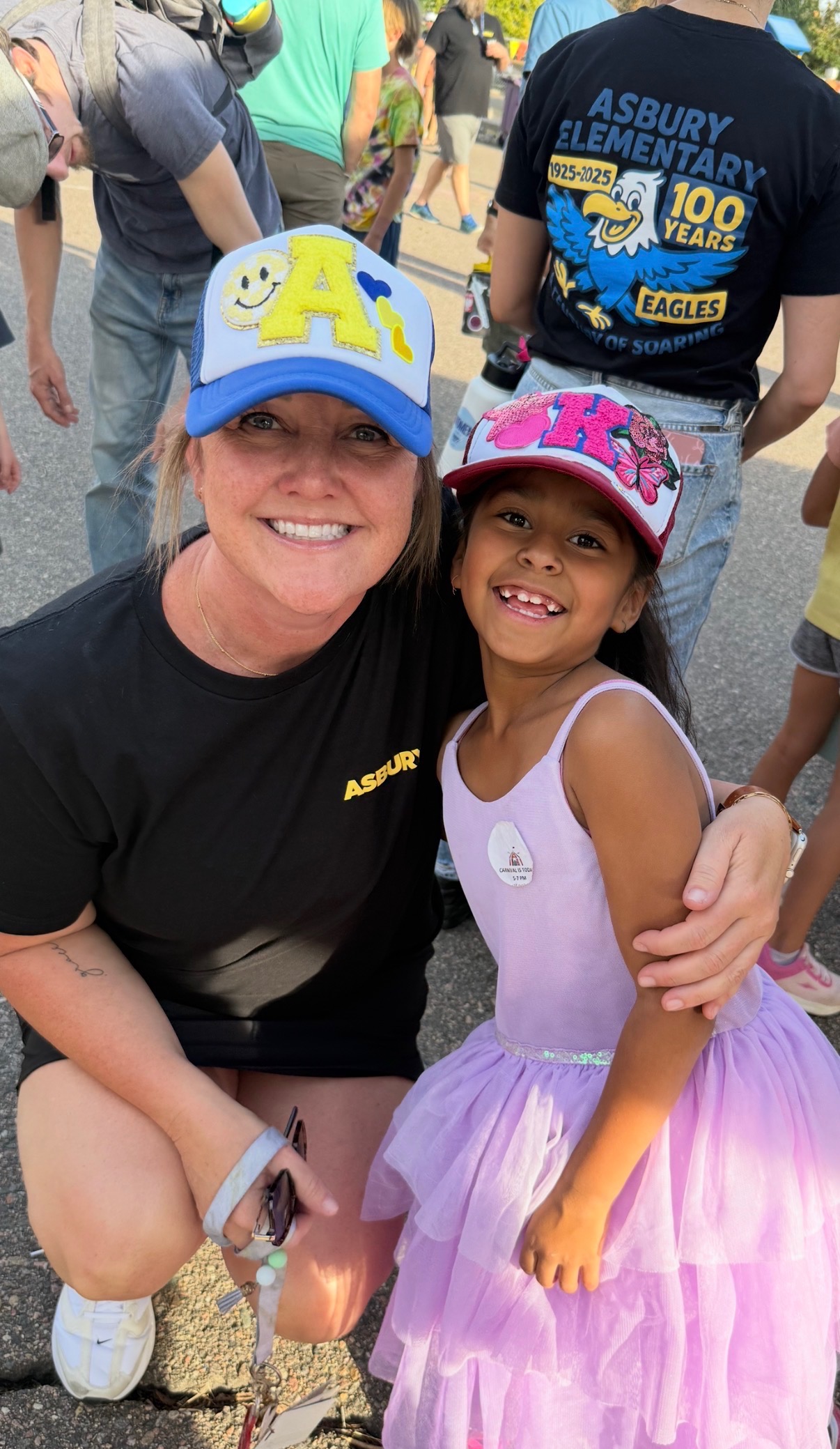 teacher and student with hats