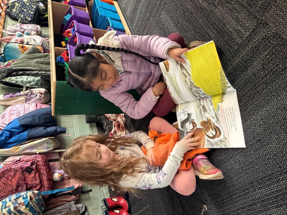 Ayla and Charlotte share books