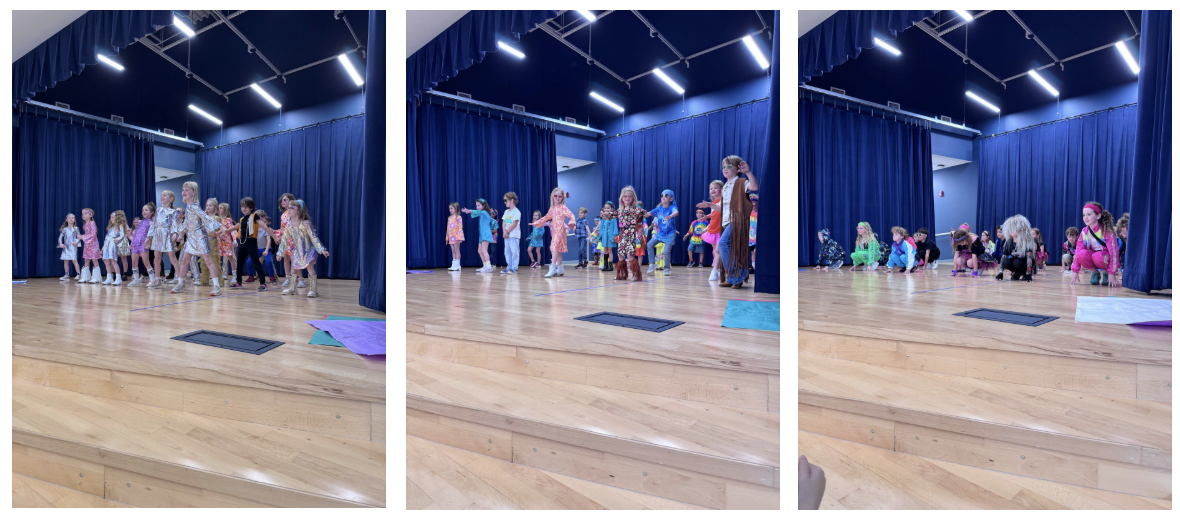 Elementary students in colorful decade-themed outfits perform a dance on a small stage with blue curtains during a school celebration.