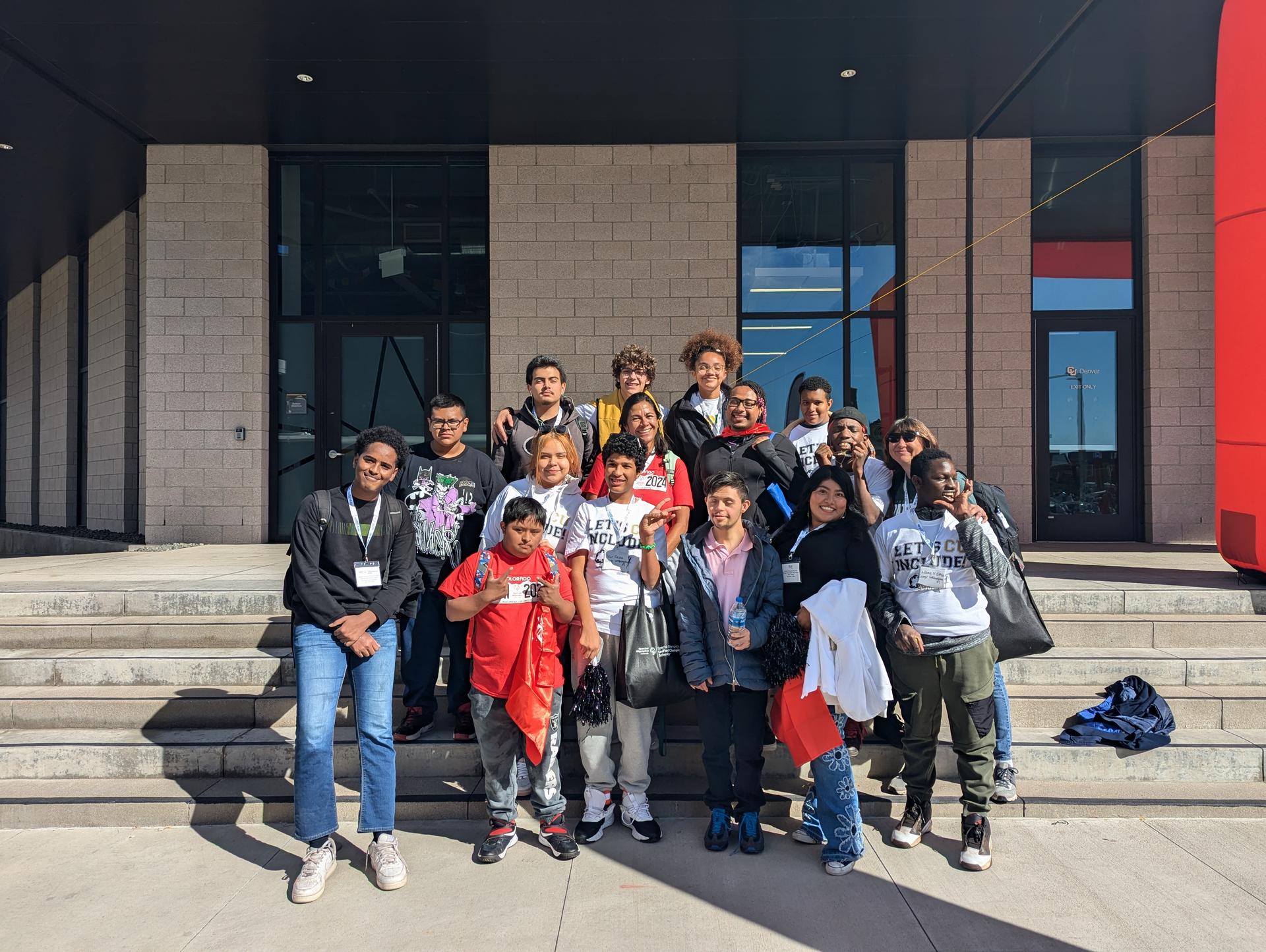 Students in a group smiling