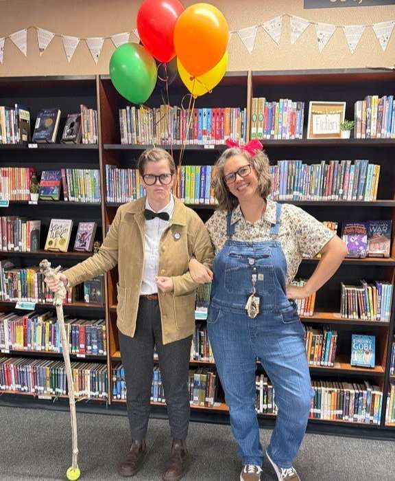 Teachers dressed in costumes- up themed