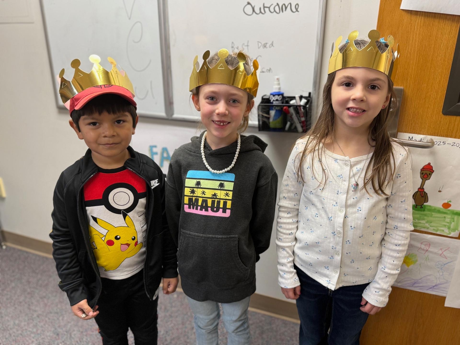 Three Westwood elementary students recognized for demonstrating safe, respectful, and responsible behavior posing for a group photo