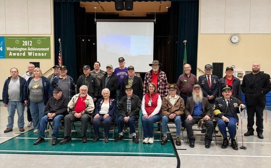 Soutwhood Veterans Day Assembly with group photo of visiting veterans