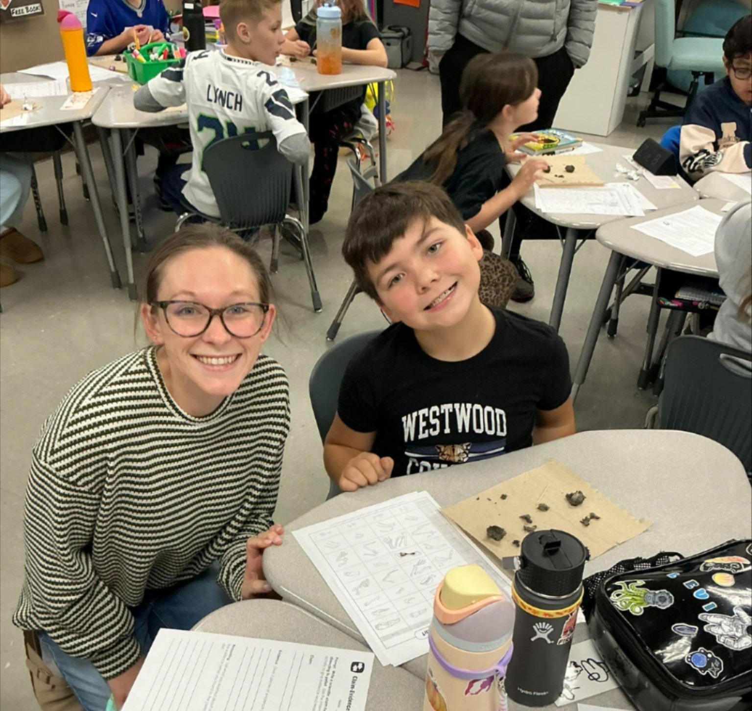 Westwood students dissecting owl pellets in the classroom