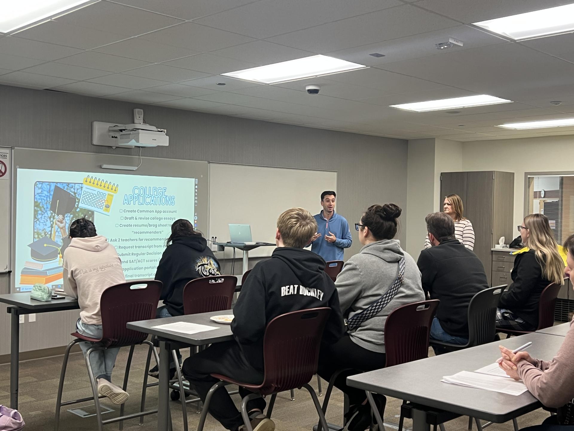 Students and families at EHS listening to a session presentation on college applications