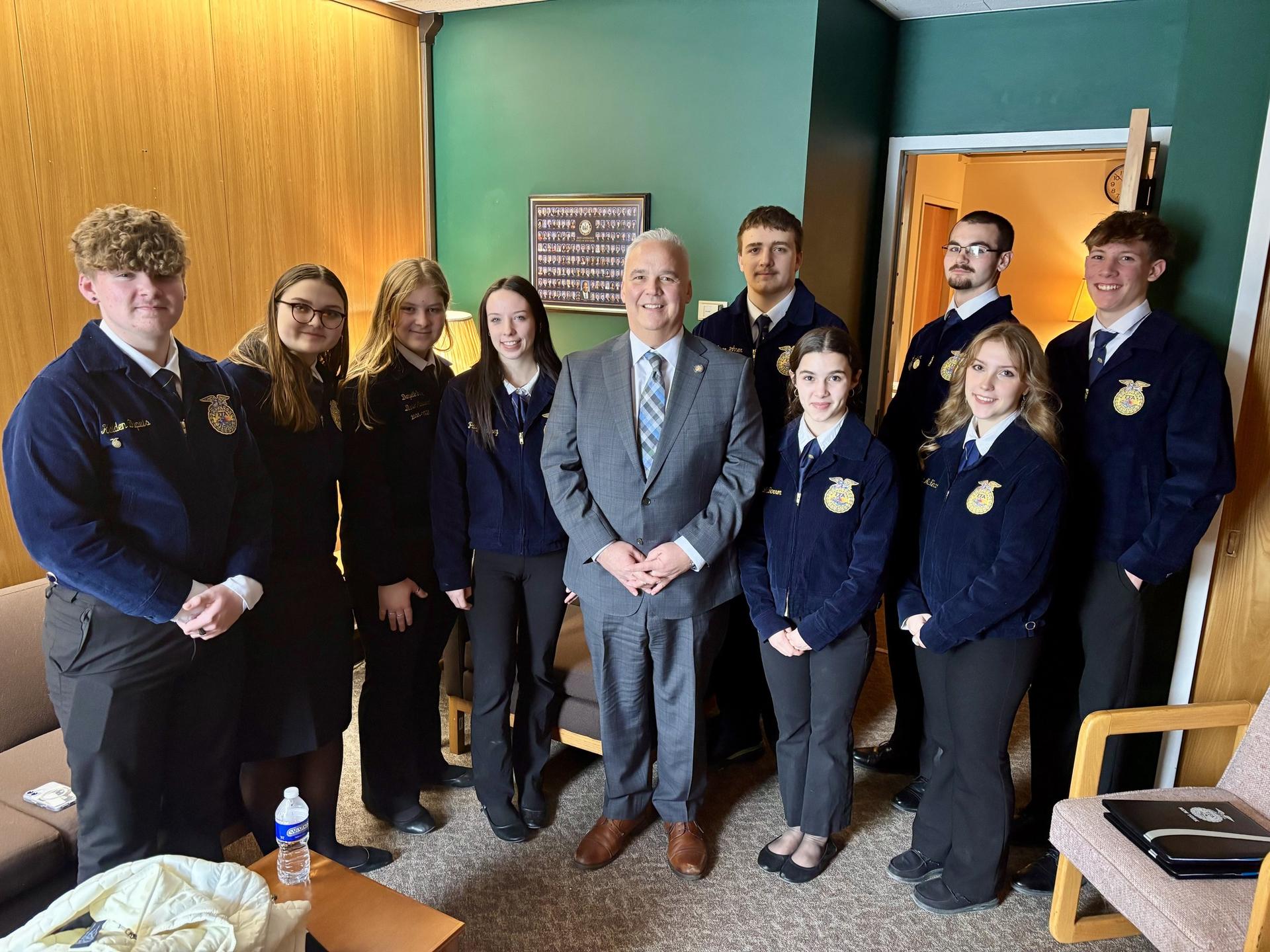 A group of FFA teens walking the hallways of the Jr/Sr High in their Granville FFA jackets