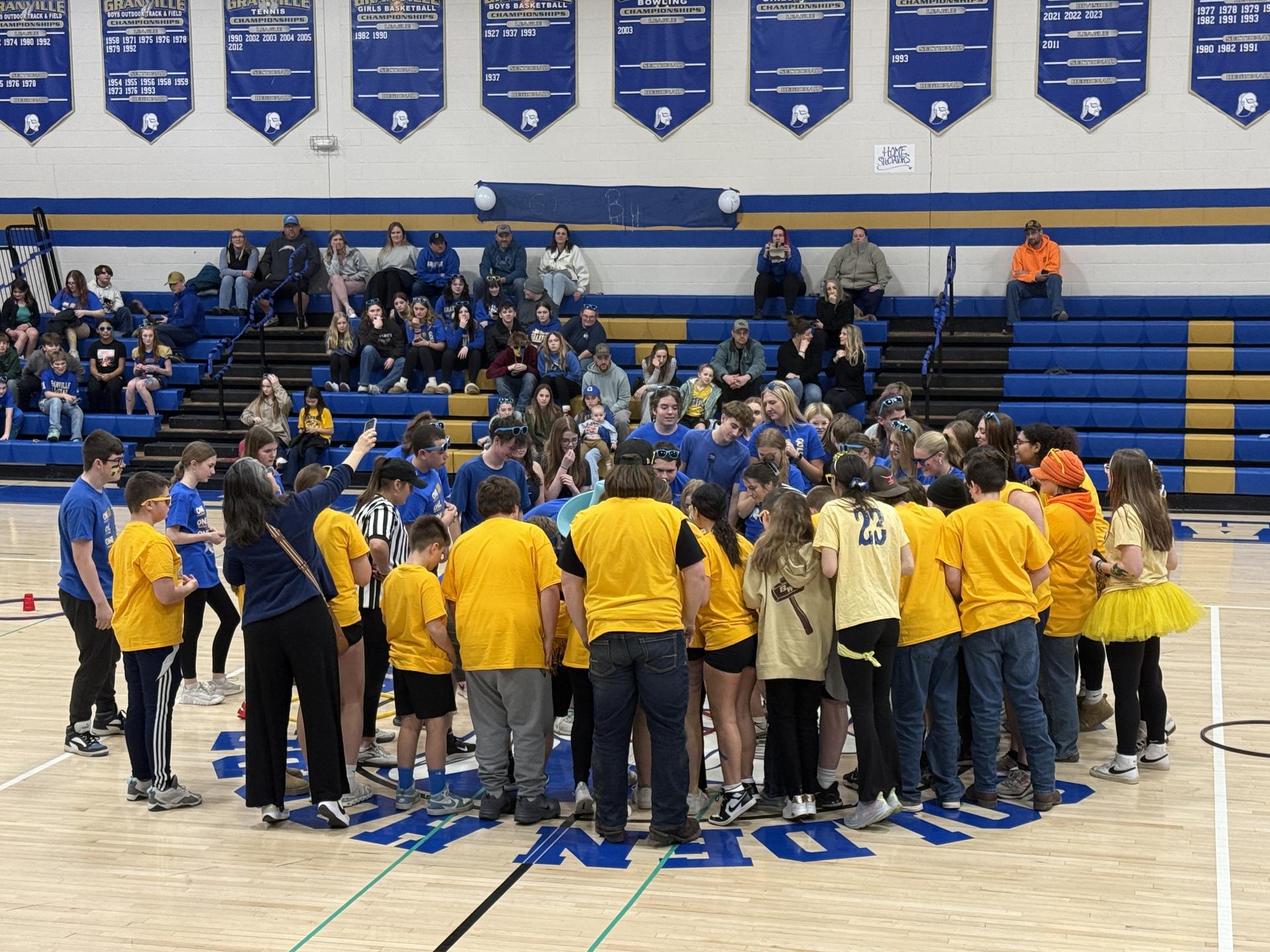 A group of FFA teens walking the hallways of the Jr/Sr High in their Granville FFA jackets