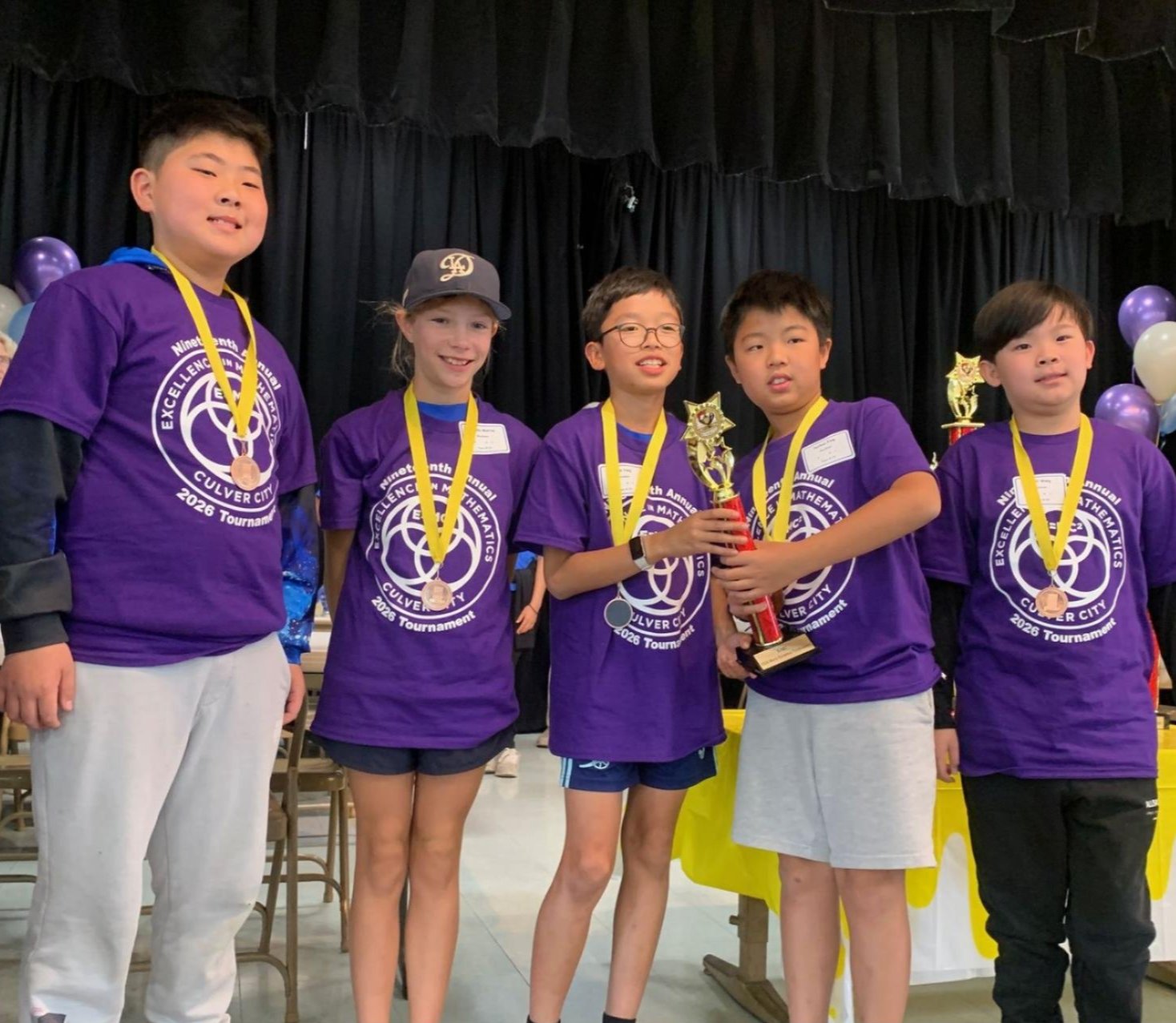 Meadows mathletes wearing award ribbons