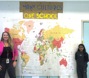 Principal Vavao and Student in Front of Map