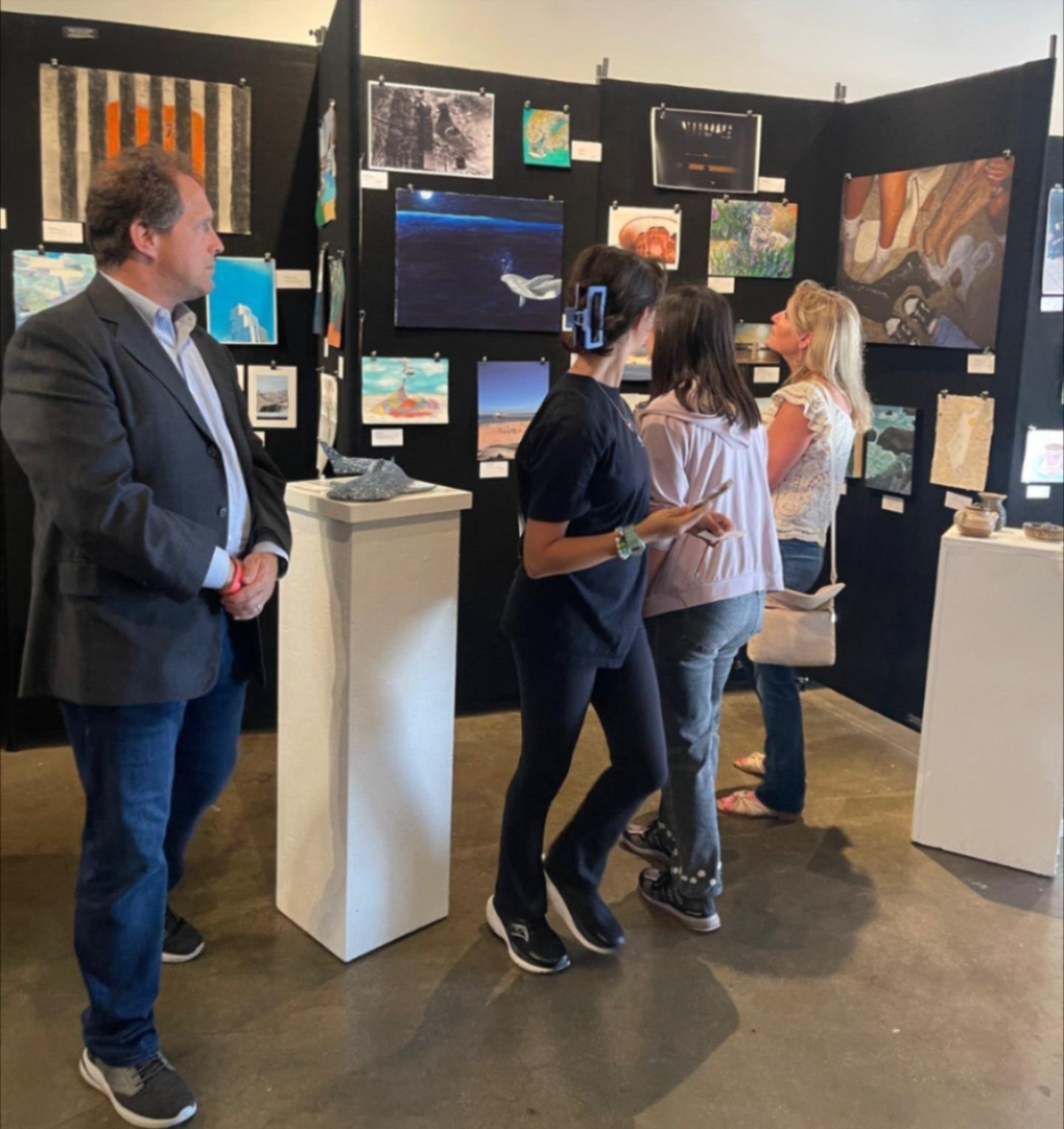 People looking at artwork