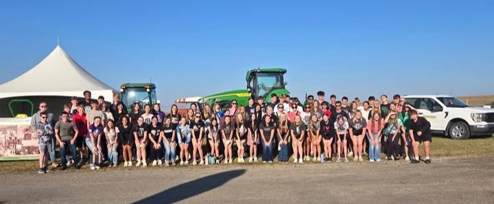 Students in front of tractor