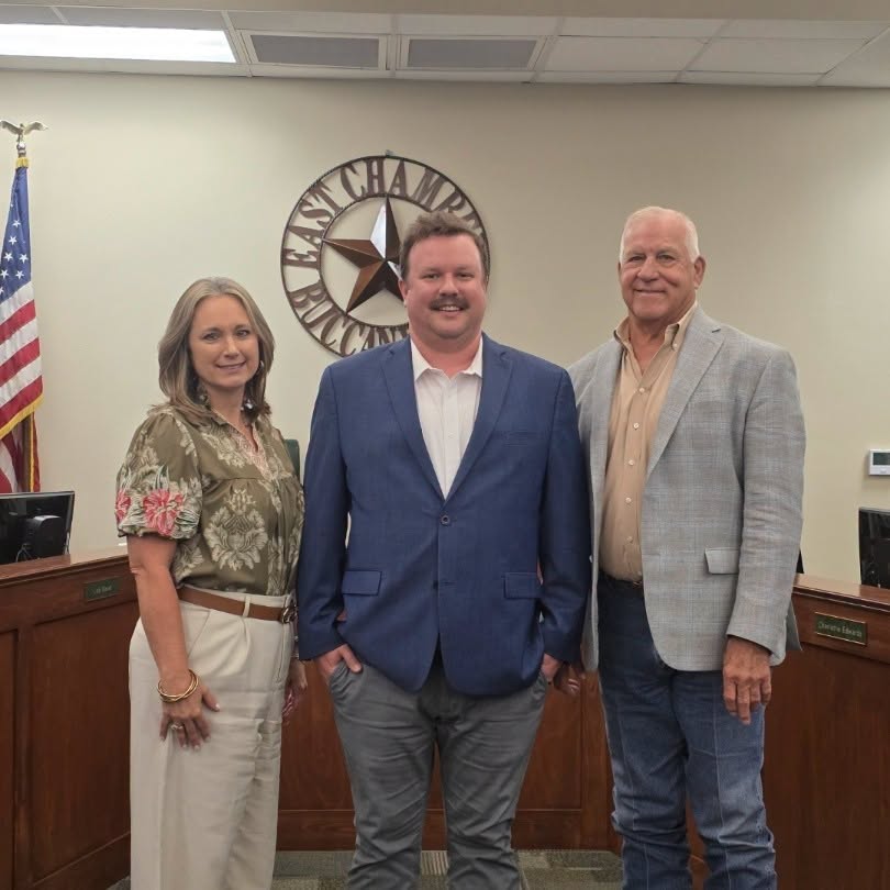 superintendent and board president with new technology director