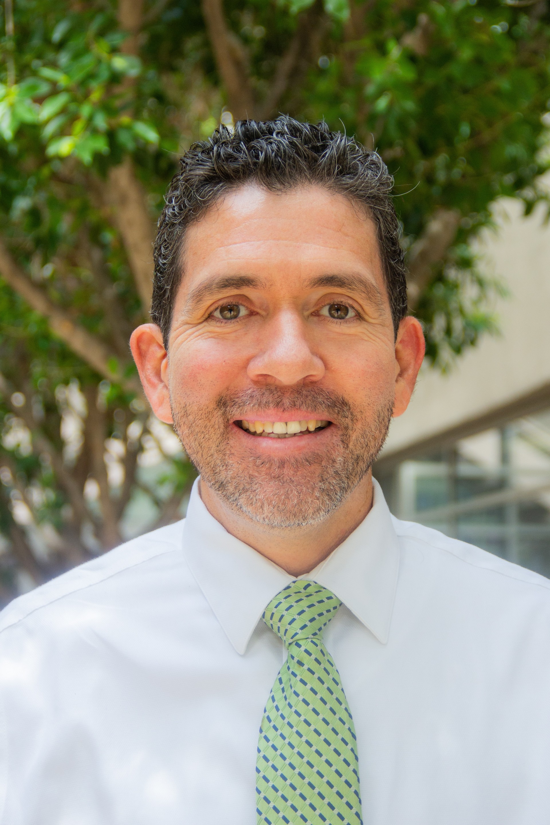 photo headshot of man with green tie, Mr. Soto the principal