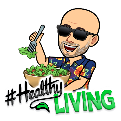 man with sunglasses eating a green salad 