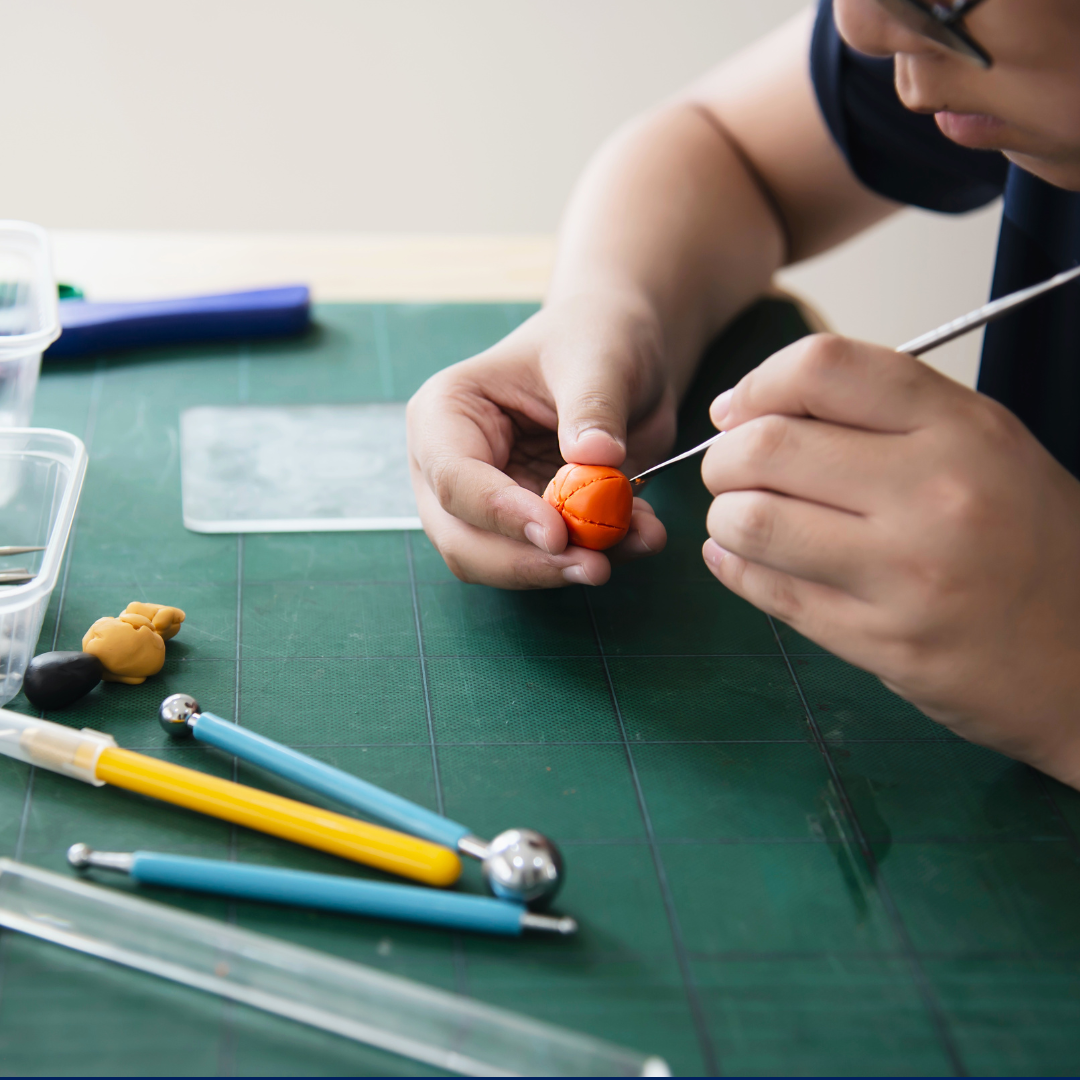 Student making clay