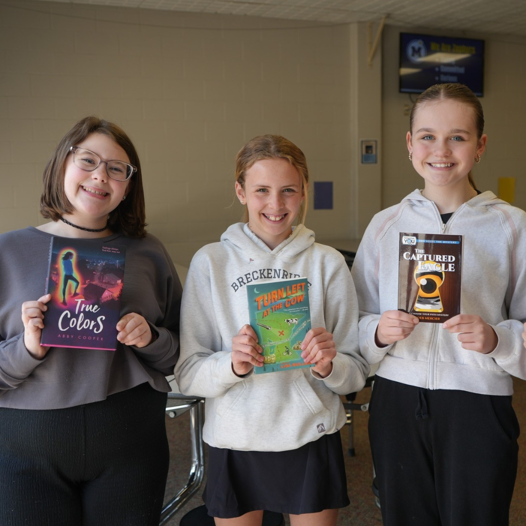Students holding books