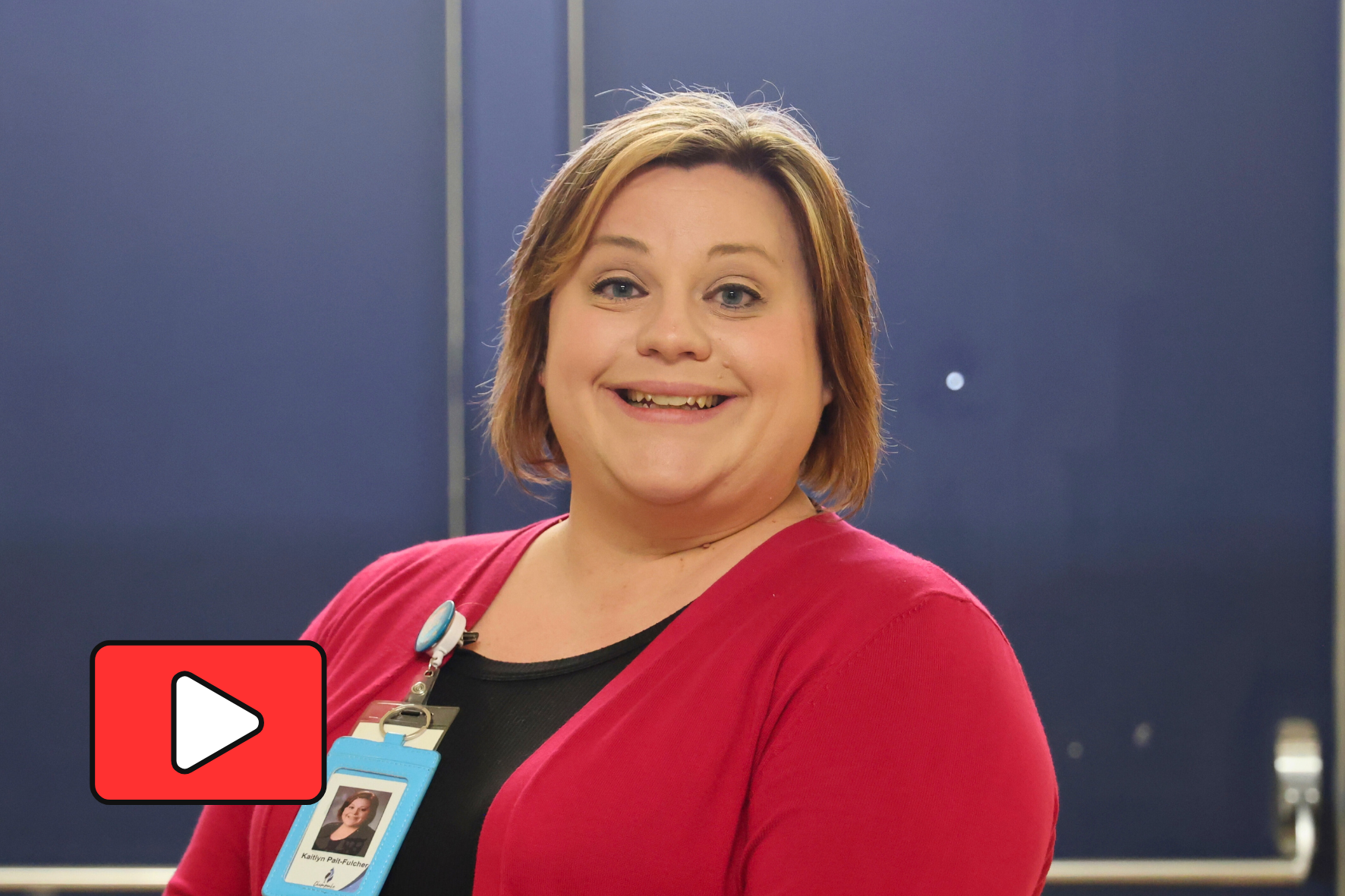 Katie smiling with a YouTube play button.