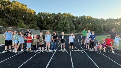 Youth runners lined up on the track