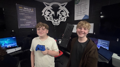 Jayse and Marshall with a video game controller