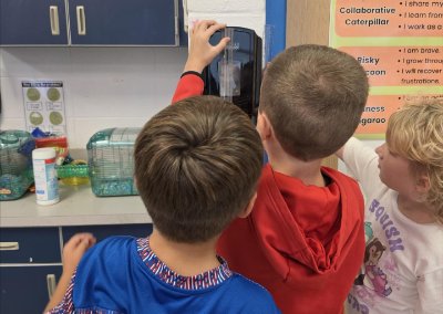 2nd graders using a ruler