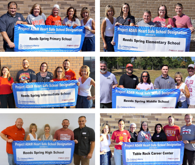 Staff from all six district schools holding Project Adam banners