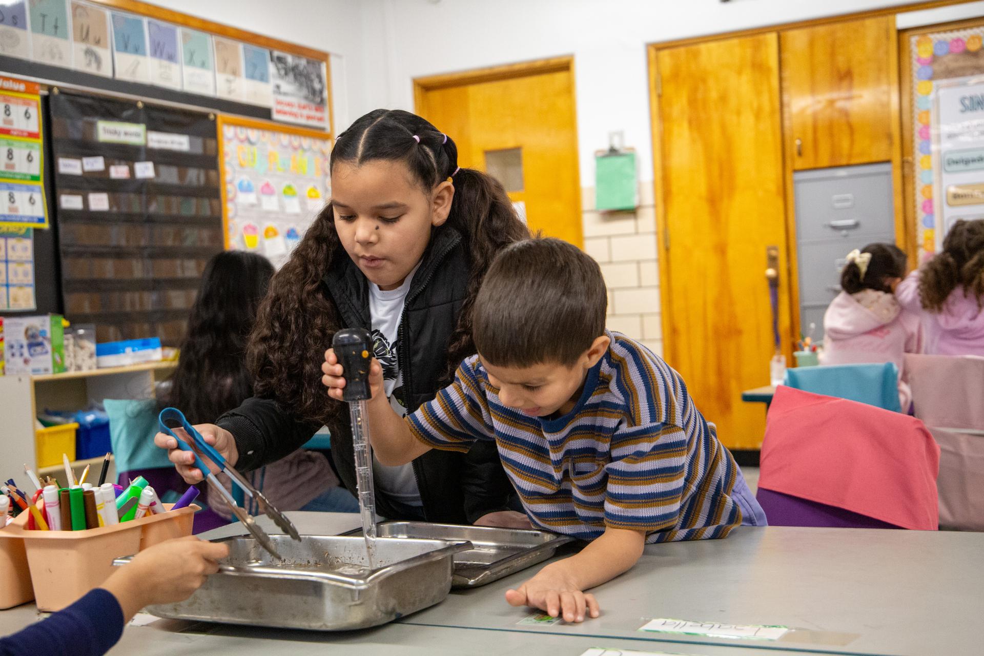 Two students practice yoga at Ellis Adventure day.