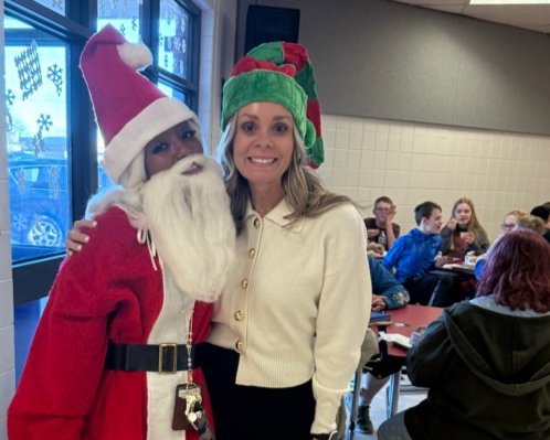 Dr. Hottelman dressed as an elf and Mrs. Claybon dressed as santa 