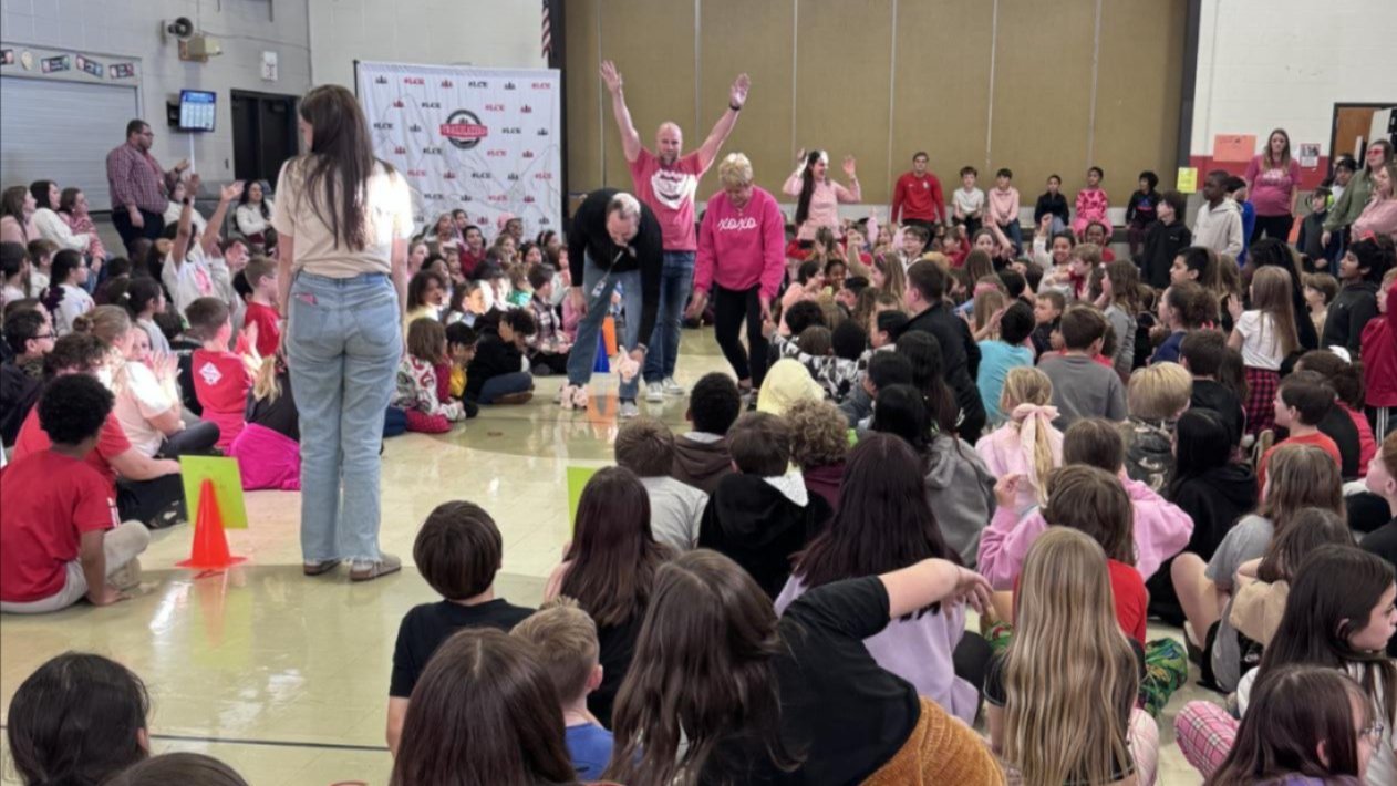 Two photographs of the Employee and Educator of the Year with the principals, holding certificates and flowers. 