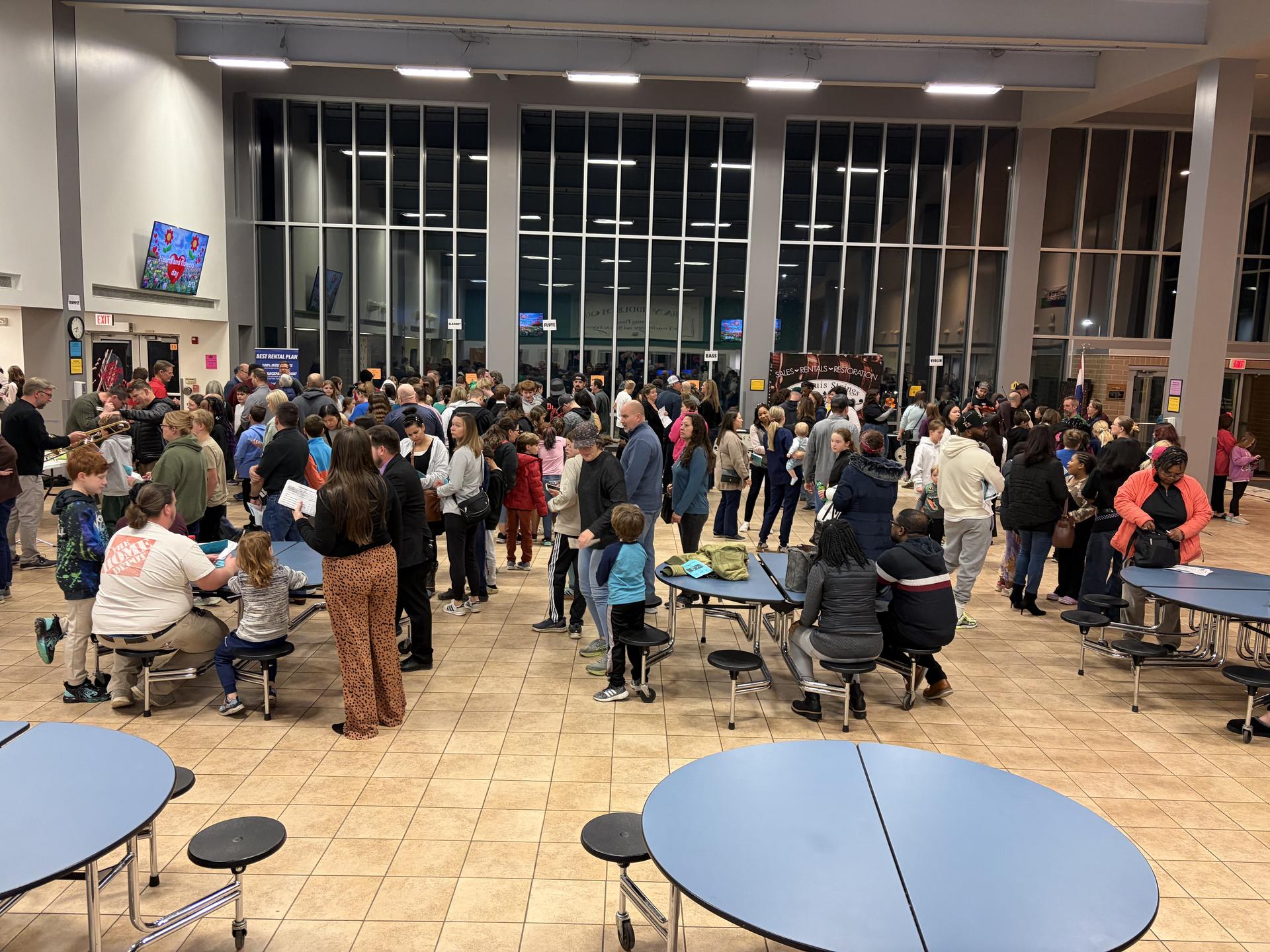 Photo of DuBray Middle School preview night; families in the commons.