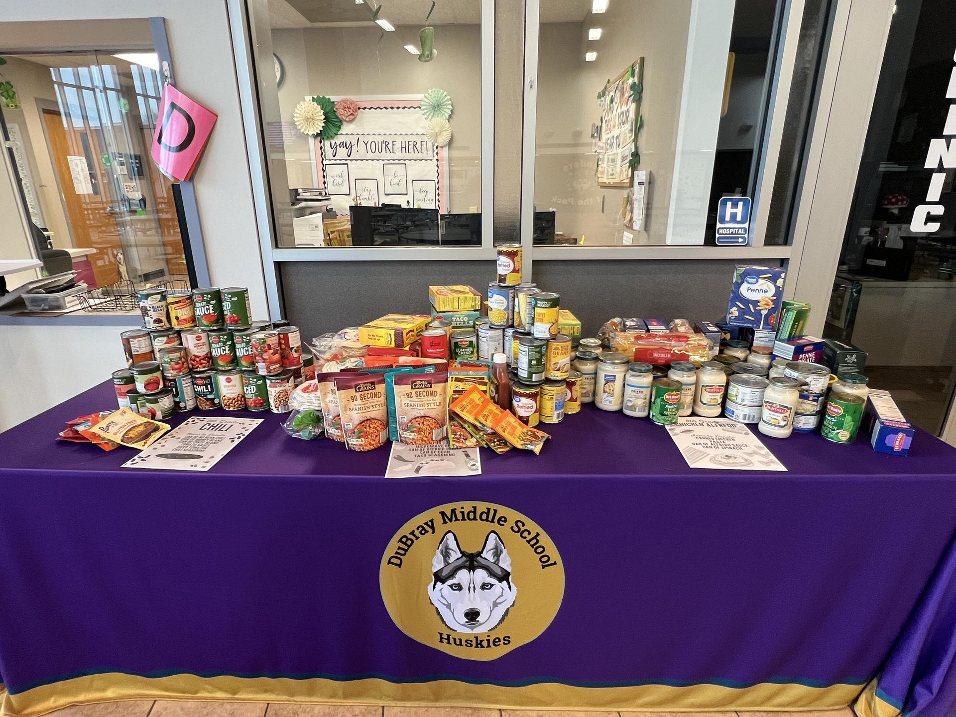 Photo of table and donations after the last day of the NJHS food drive.