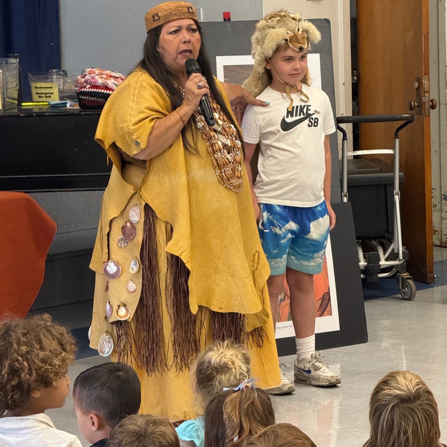 student wearing animal skin