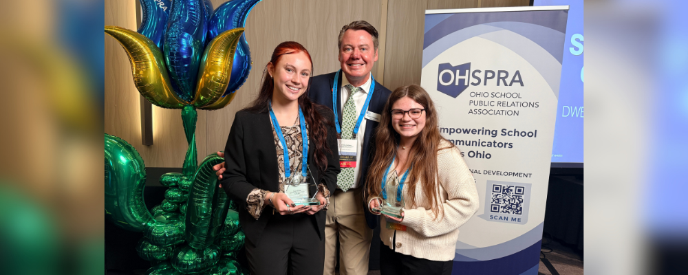 Two students holding awards with a representative of OHSPRA.