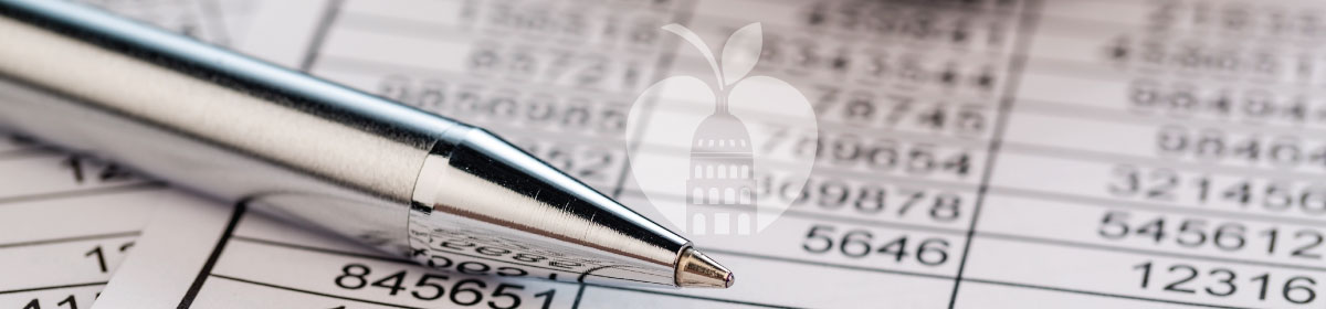 An image of a pen sitting on a document with numbers. 