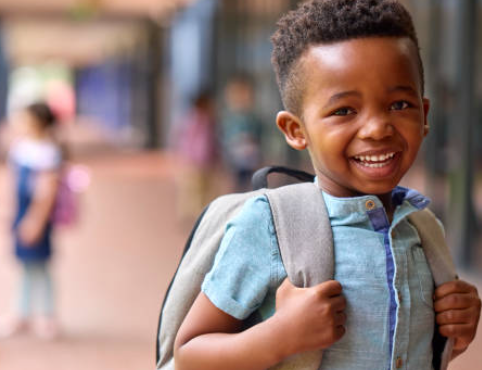 Smiling Boy with a Backpack