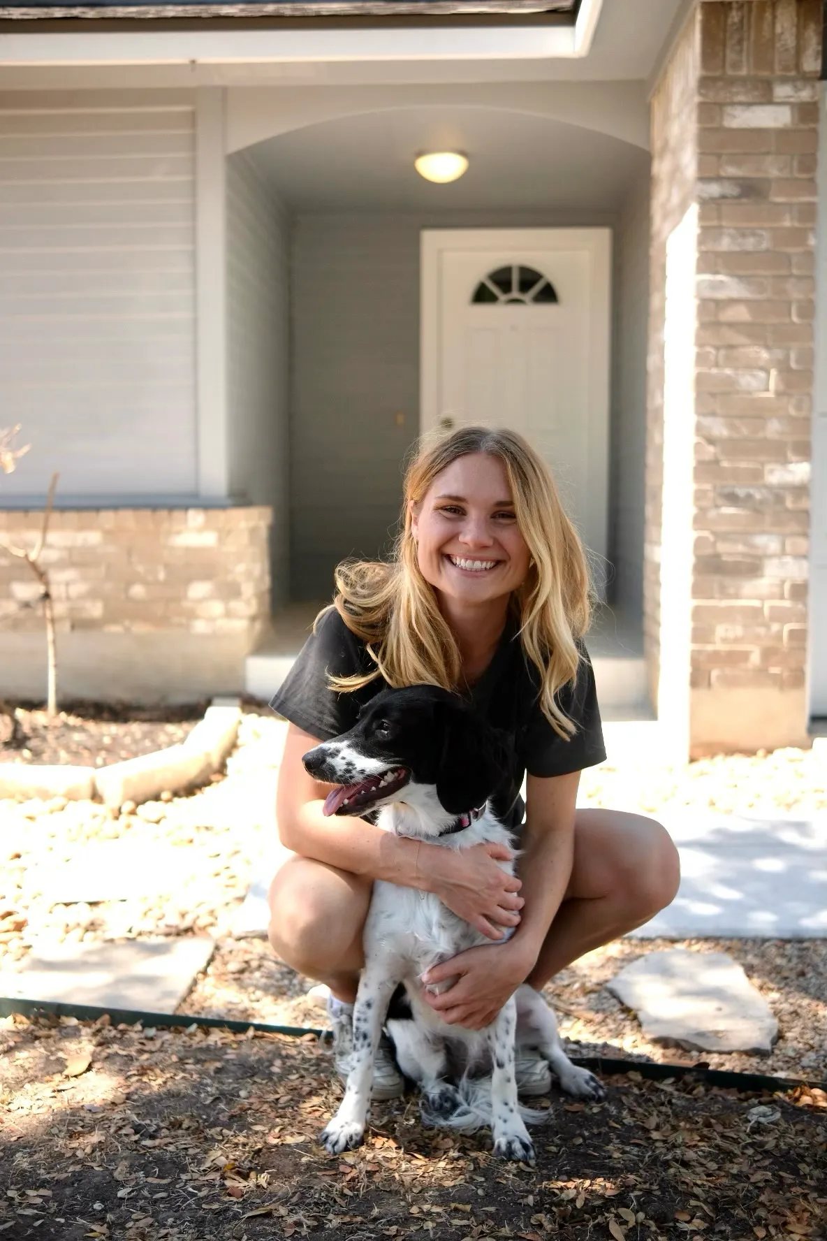 Ms. Abby and her dog smiling