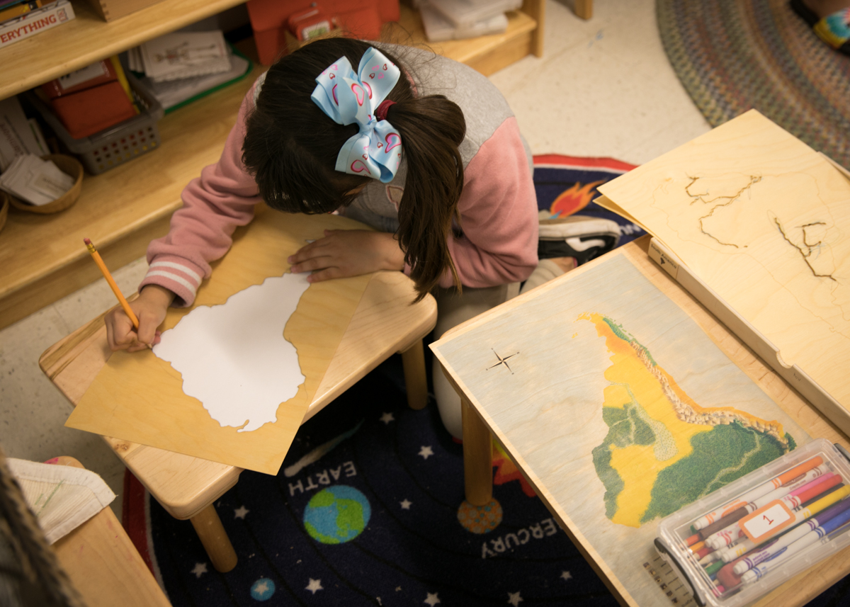 Student working on a map of Africa