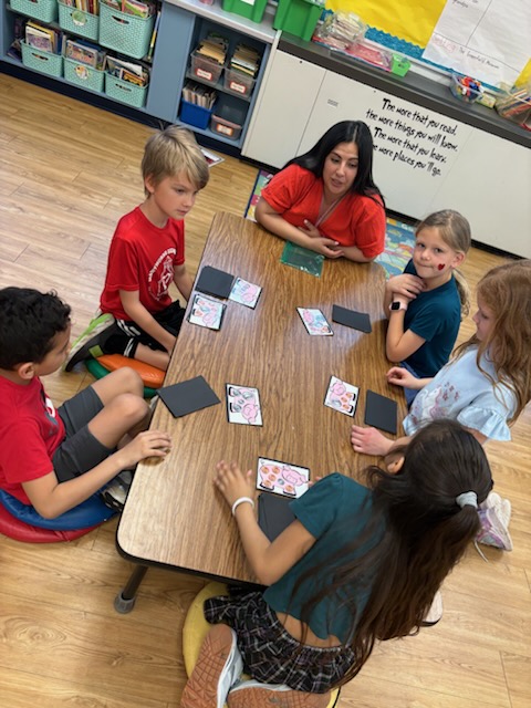 teacher working with student