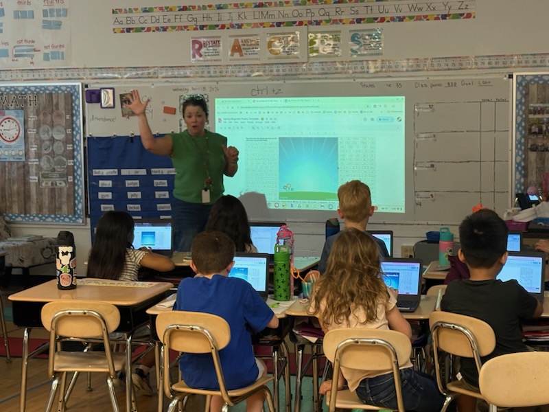 teacher working with student